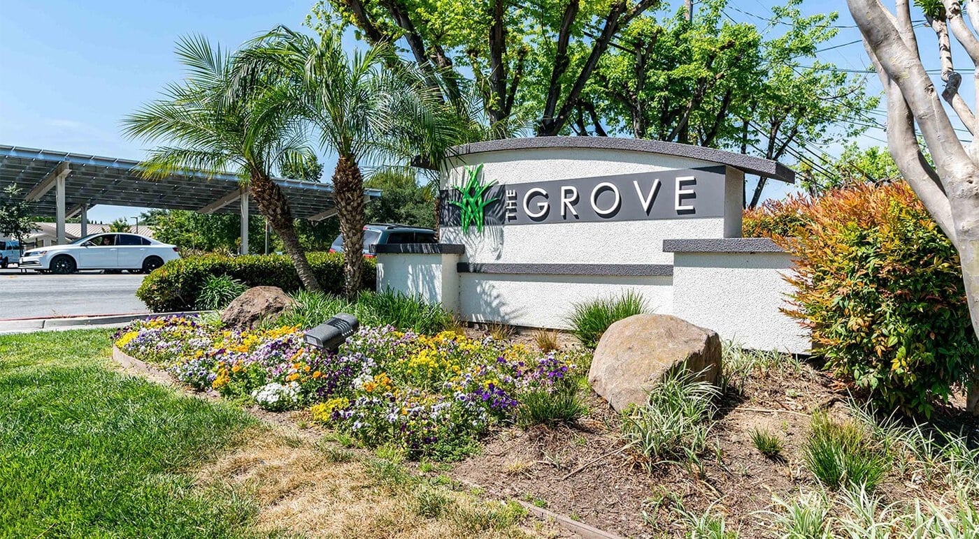 The Grove Signage With Landscaping